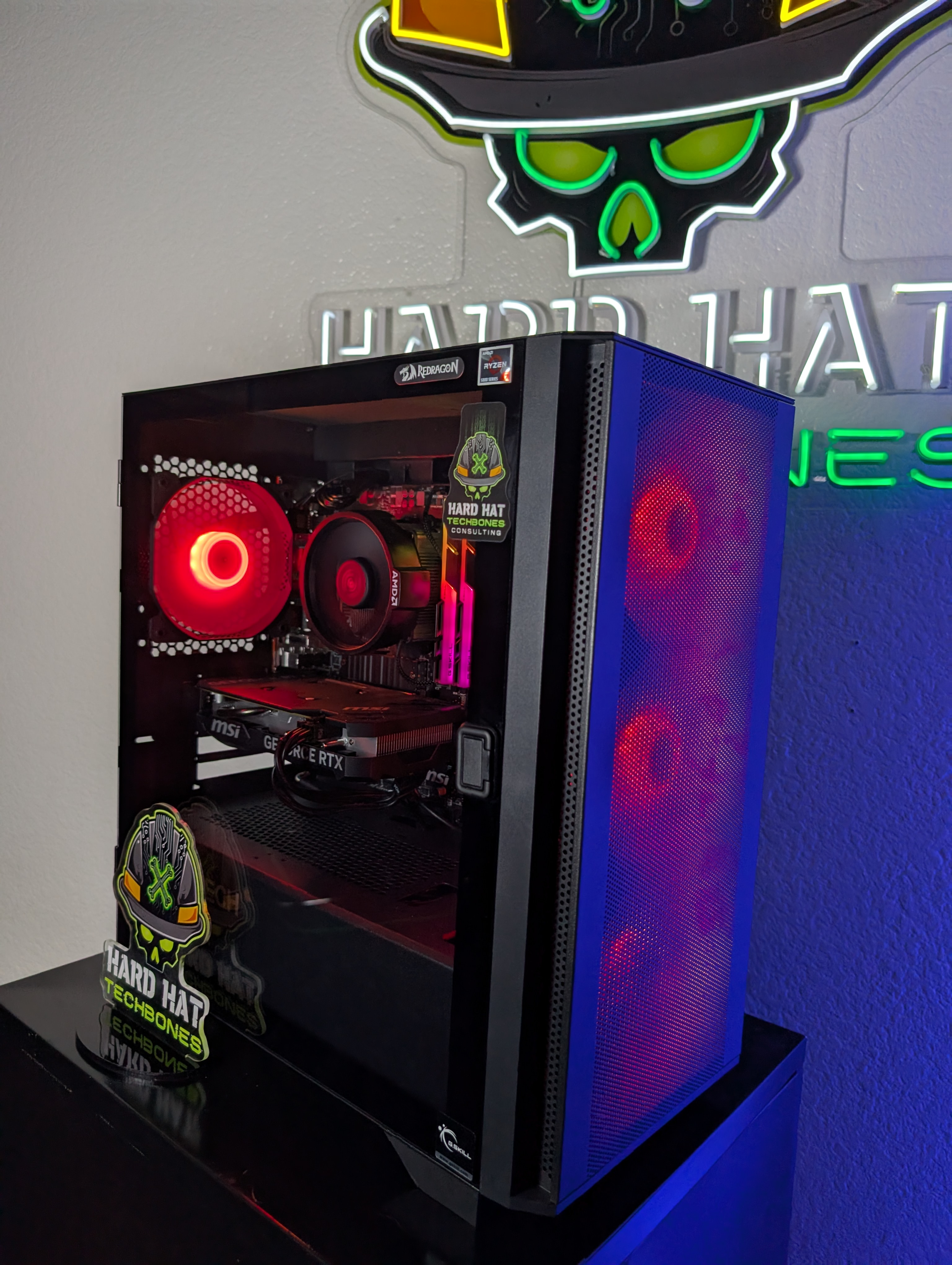 Gaming PC build showing front fans and stickers